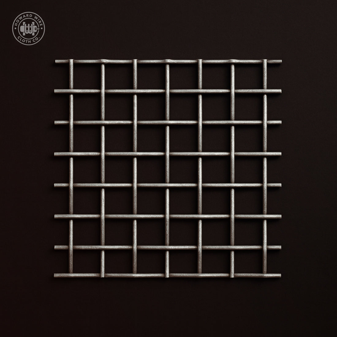 Studio product photograph of galvanized woven wire mesh, 1 inch mesh with .080 inch wire diameter, shown flat and square to camera on a dark graphite background.