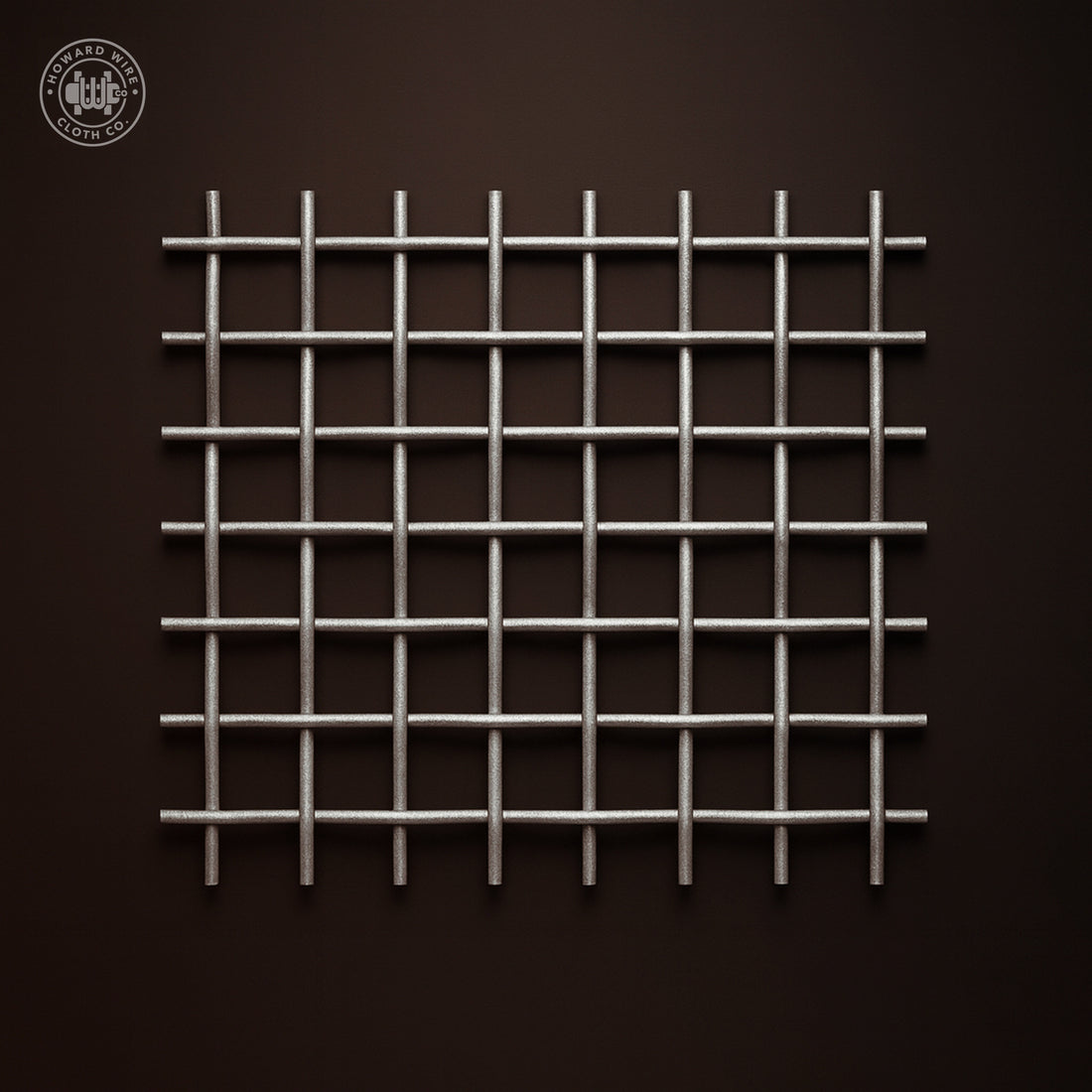 Studio product photograph of galvanized crimped woven wire mesh, 1 inch mesh with .120 inch wire diameter, shown flat and square to camera on a dark graphite background.