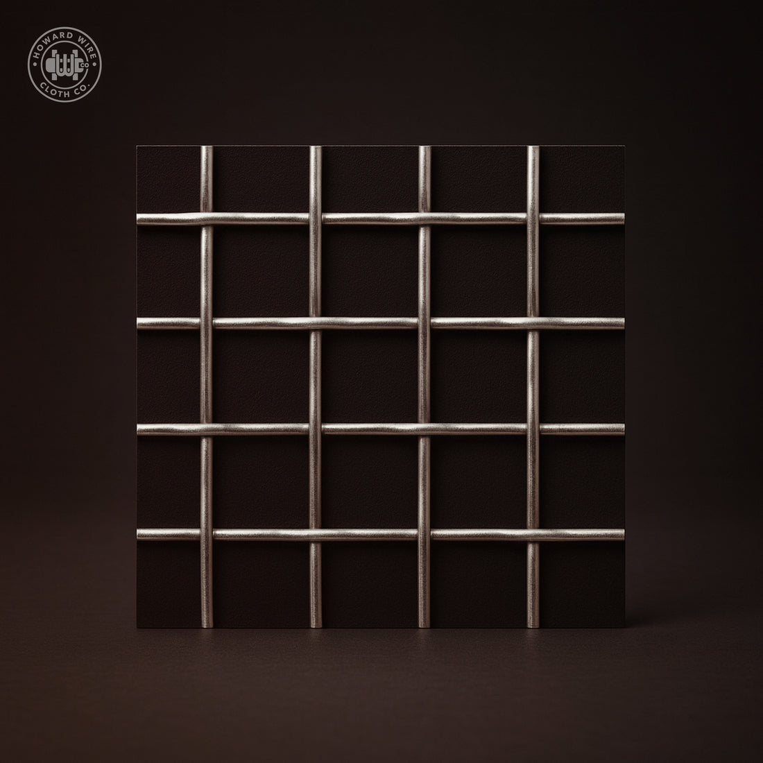 Studio product photograph of 304 stainless steel woven wire mesh, 1 inch mesh with .135 inch wire diameter, shown flat and square to camera on a dark graphite background.