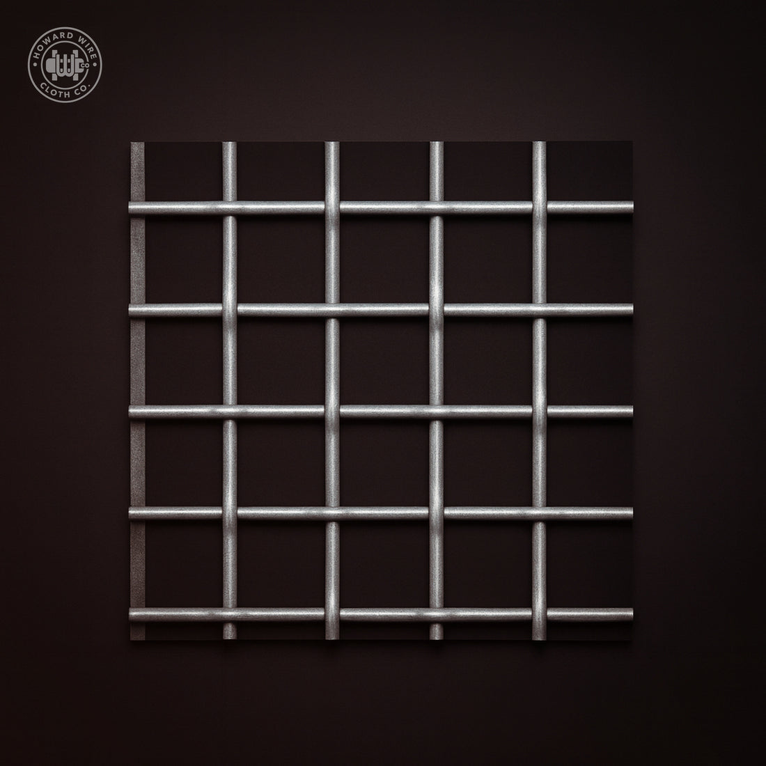 Studio product photograph of galvanized woven wire mesh, 1-1/2 inch mesh with .120 inch wire diameter, on a dark graphite background.
